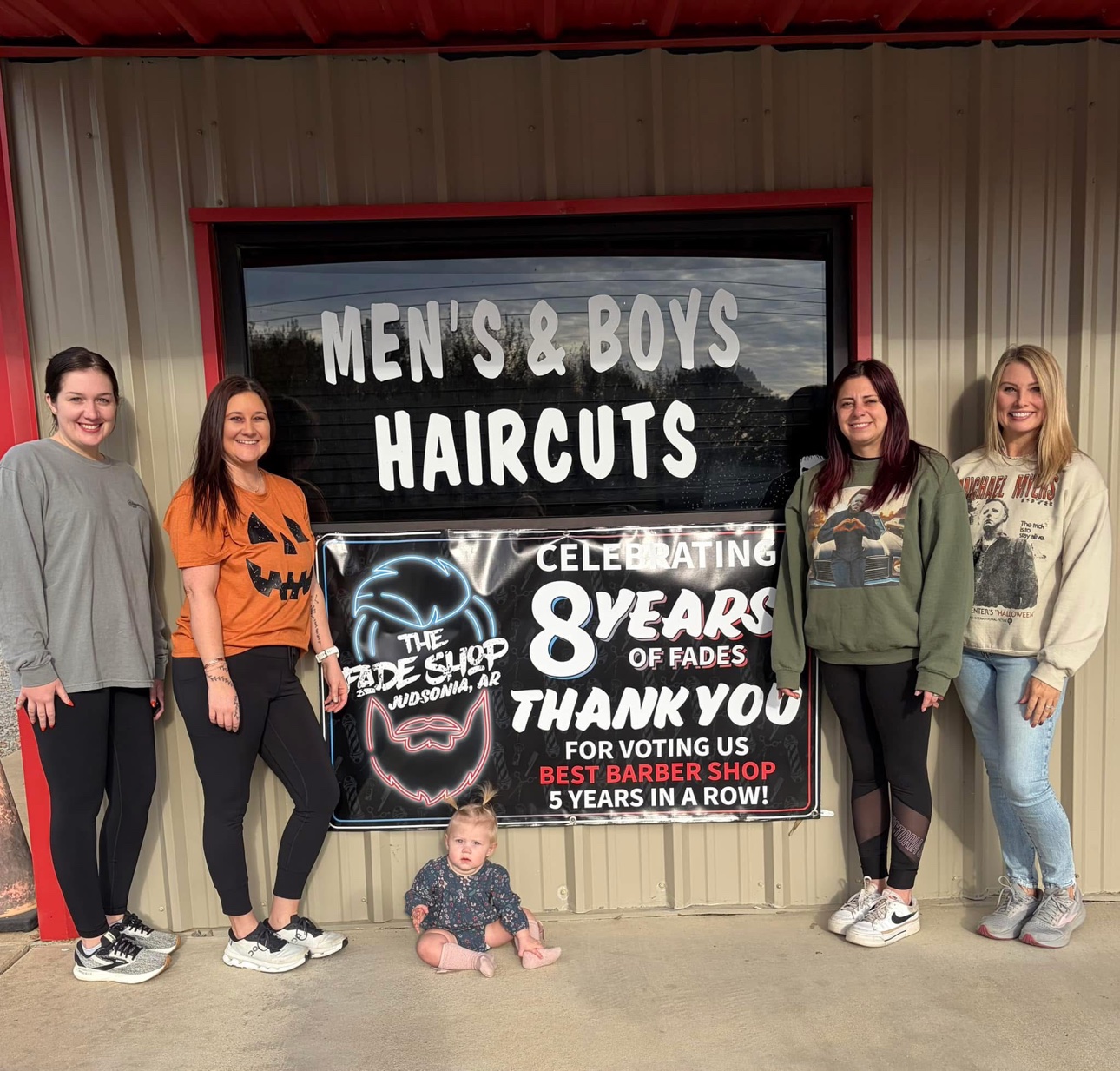 Photo outside The Fade Shop, in front of the Men's & Boys Haircuts window